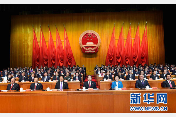 10月1日，慶祝中華人民共和國成立66周年暨新疆維吾爾自治區成立60周年大會在新疆人民會堂隆重舉行。 新華社記者 饒愛民 攝