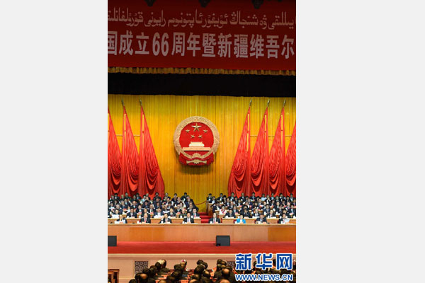 10月1日，慶祝中華人民共和國成立66周年暨新疆維吾爾自治區成立60周年大會在新疆人民會堂隆重舉行。 新華社記者 高潔 攝 